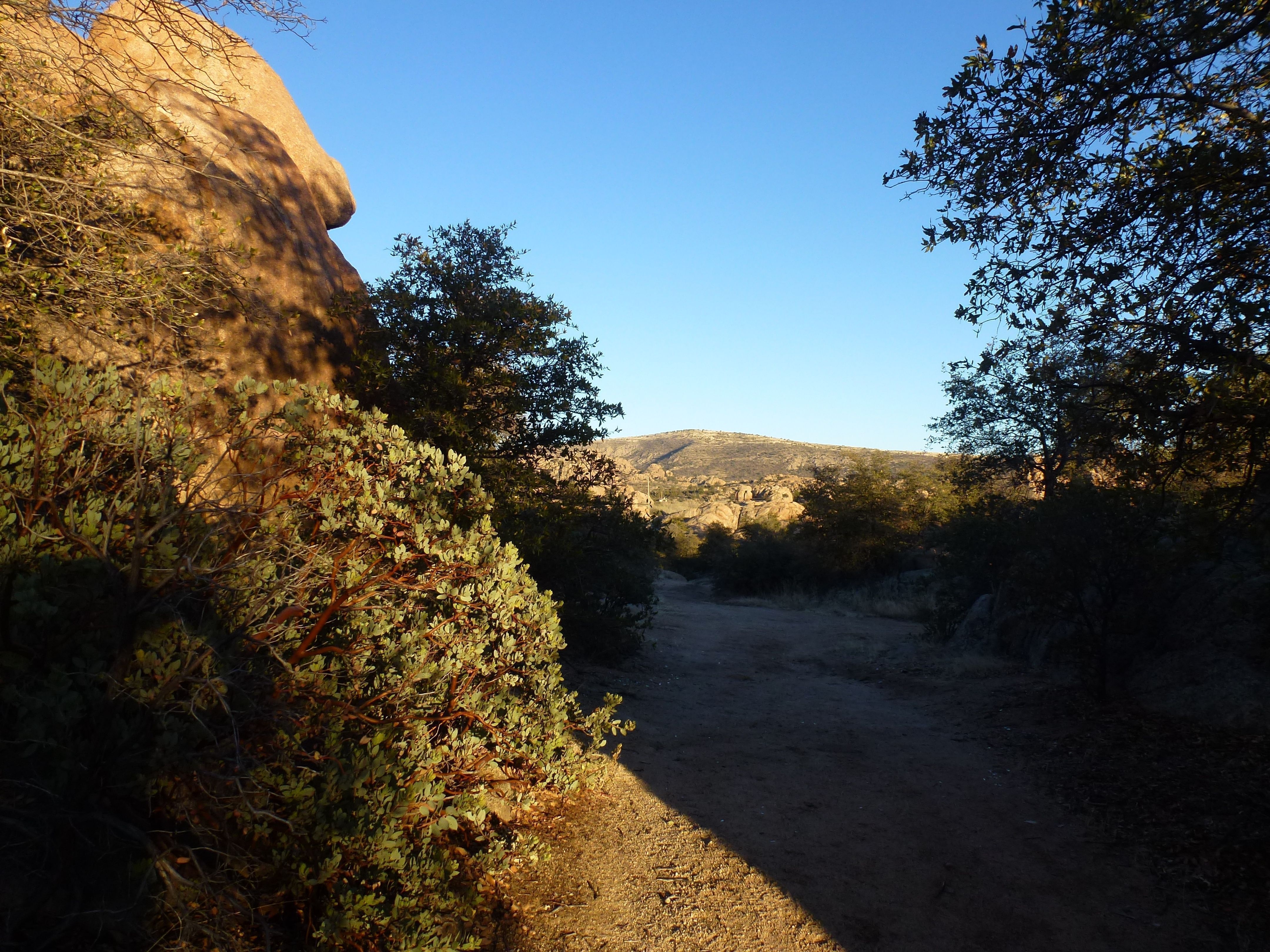 Granite Dells trail with mountain ridge view in Prescott, Arizona