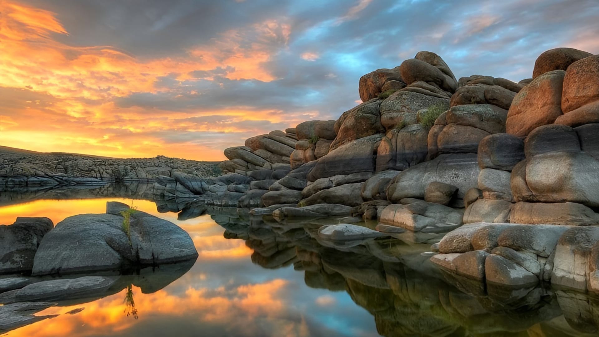 Watson Lake at sunset reflecting Granite Dells boulders, Prescott Arizona