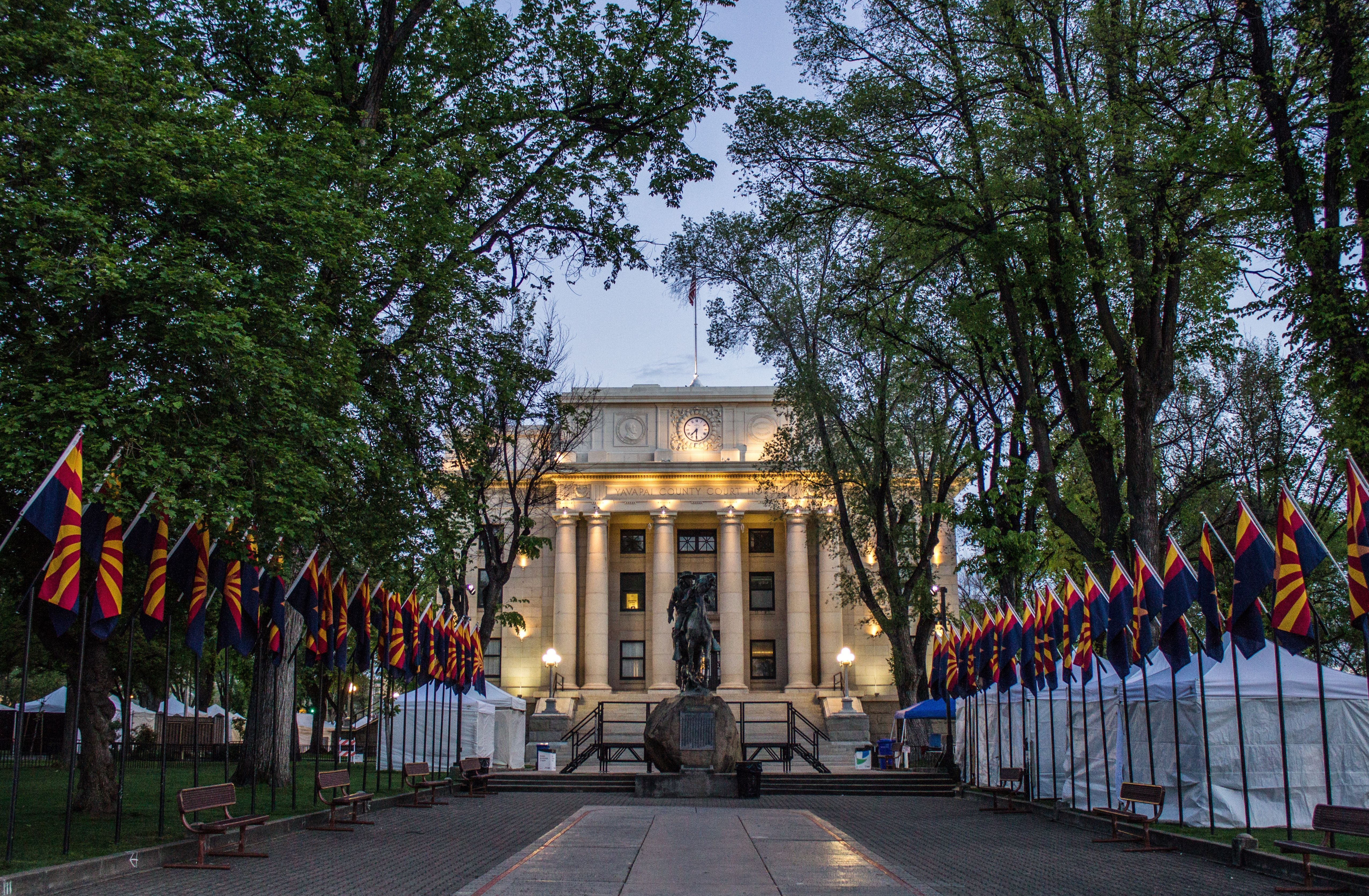 Yavapai County Courthouse with the Arizona flag walkway at dusk in downtown Prescott, Arizona
